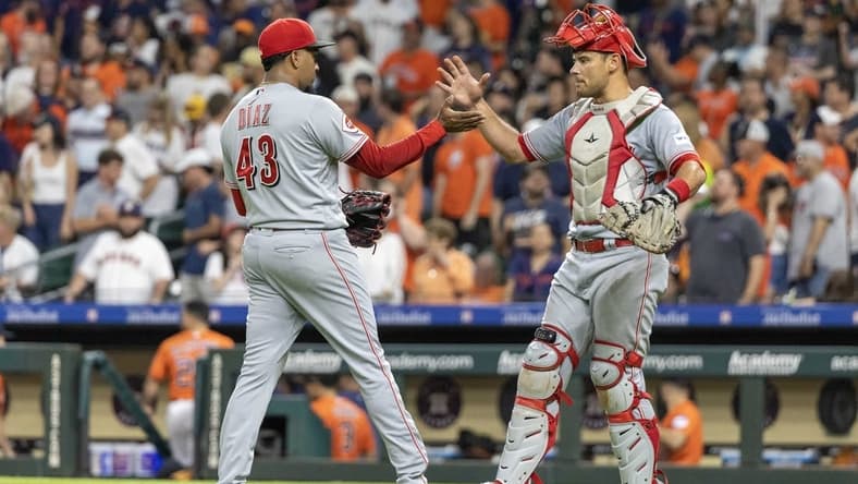 Jun 16, 2023; Houston, Texas, USA;  Cincinnati Reds relief pitcher Alexis Diaz (43) and  catcher Luke Maile (22) celebrate the win agains the Houston Astros  at Minute Maid Park. Mandatory Credit: Thomas Shea-USA TODAY Sports