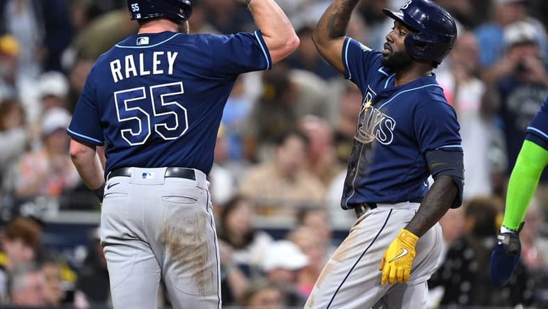 Jun 16, 2023; San Diego, California, USA; Tampa Bay Rays left fielder Randy Arozarena (right) is congratulated by right fielder Luke Raley (55) after hitting a three-run home run against the San Diego Padres during the fifth inning at Petco Park. Mandatory Credit: Orlando Ramirez-USA TODAY Sports