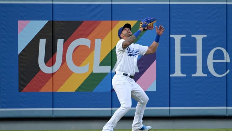 Jun 16, 2023; Los Angeles, California, USA; Los Angeles Dodgers left fielder David Peralta (6) makes a catch for an out in the first inning against the San Francisco Giants at Dodger Stadium. Mandatory Credit: Jayne Kamin-Oncea-USA TODAY Sports