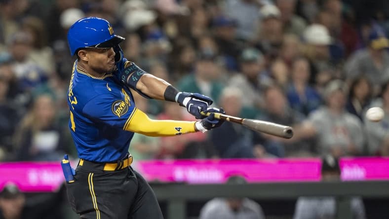 Jun 16, 2023; Seattle, Washington, USA; Seattle Mariners centerfielder Julio Rodriguez (44) hits a double off Chicago White Sox starting pitcher Michael Kopech (34) during the fifth inning at T-Mobile Park. Mandatory Credit: Stephen Brashear-USA TODAY Sports