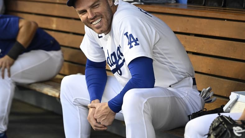 Jun 16, 2023; Los Angeles, California, USA; Los Angeles Dodgers first baseman Freddie Freeman (5) laughs in the dugout prior to the game against the San Francisco Giants at Dodger Stadium. Mandatory Credit: Jayne Kamin-Oncea-USA TODAY Sports