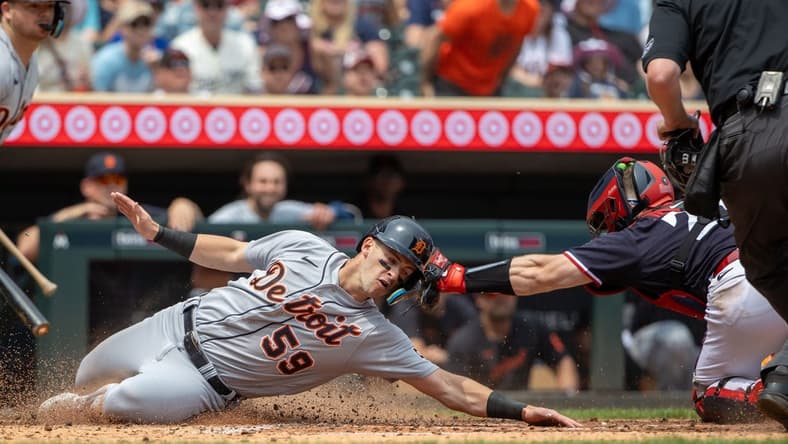 Jun 17, 2023; Minneapolis, Minnesota, USA; Detroit Tigers third baseman Zack Short (59) is tagged out at home plate by Minnesota Twins catcher Ryan Jeffers (27) during the fifth inning at Target Field. Mandatory Credit: Jesse Johnson-USA TODAY Sports