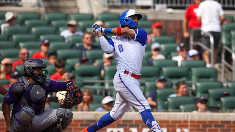 Jun 17, 2023; Atlanta, Georgia, USA; Atlanta Braves left fielder Eddie Rosario (8) hits a two-run home run against the Colorado Rockies in the third inning at Truist Park. Mandatory Credit: Brett Davis-USA TODAY Sports