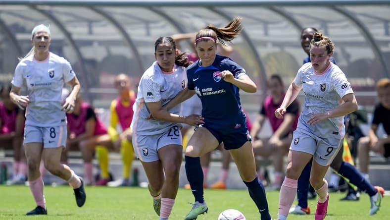 Jun 17, 2023; San Diego, California, USA; San Diego Wave FC defender Abby Dahlkemper (2), Angel City FC midfielder Lily Nabet (28), and Angel City FC midfielder Savannah McCaskill (9) battle for the ball during the first half at Snapdragon Stadium. Mandatory Credit: Ray Acevedo-USA TODAY Sports