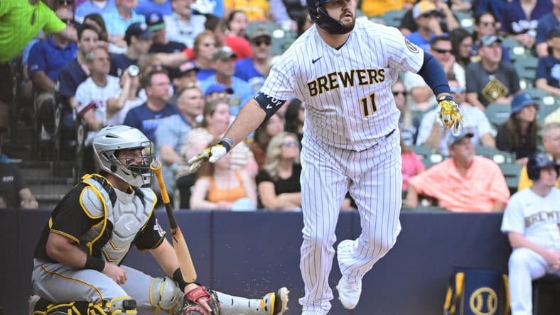 Jun 17, 2023; Milwaukee, Wisconsin, USA; Milwaukee Brewers first baseman Rowdy Tellez (11) hits a double to drive in two runs against the Pittsburgh Pirates in the fifth inning at American Family Field. Mandatory Credit: Benny Sieu-USA TODAY Sports