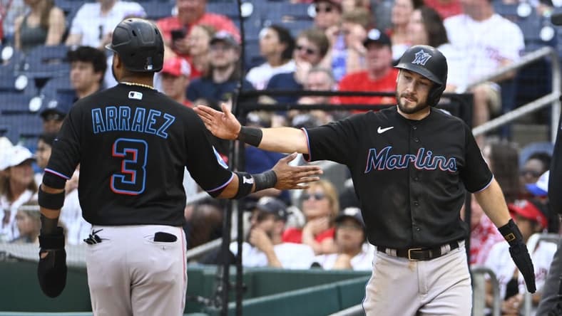 Jun 17, 2023; Washington, District of Columbia, USA; Miami Marlins shortstop Garrett Hampson (1) and second baseman Luis Arraez (3) celebrate after scoring against the Washington Nationals during the ninth inning at Nationals Park. Mandatory Credit: Brad Mills-USA TODAY Sports