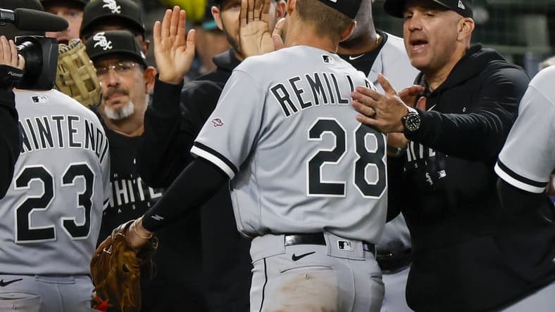 Jun 17, 2023; Seattle, Washington, USA; Chicago White Sox second baseman Zach Remillard (28) high fives manager Pedro Grifol, right, following a 4-3 victory against the Seattle Mariners in eleven innings at T-Mobile Park. Mandatory Credit: Joe Nicholson-USA TODAY Sports