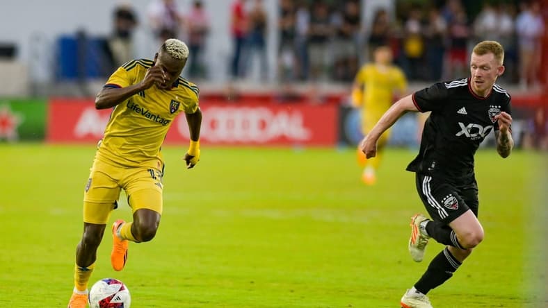 Jun 17, 2023; Washington, District of Columbia, USA; Real Salt Lake forward Carlos Andr s G mez (11) dribbles as h17 defends during the first half  at Audi Field. Mandatory Credit: Tommy Gilligan-USA TODAY Sports