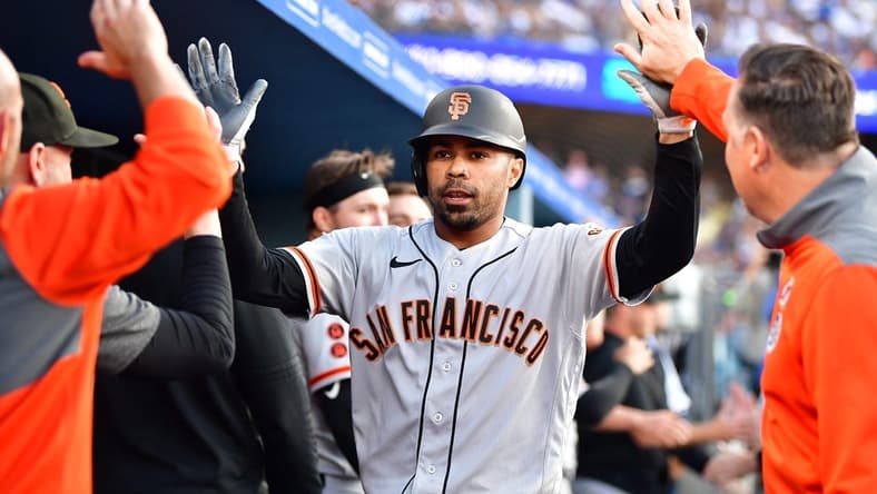 Jun 17, 2023; Los Angeles, California, USA; San Francisco Giants first baseman LaMonte Wade Jr. (31) is greeted after hitting a three run home run against the Los Angeles Dodgers during the fifth inning at Dodger Stadium. Mandatory Credit: Gary A. Vasquez-USA TODAY Sports