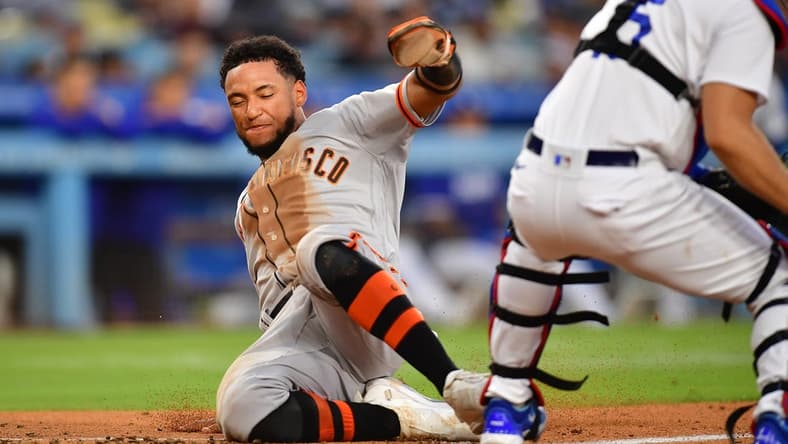 Jun 17, 2023; Los Angeles, California, USA; San Francisco Giants center fielder Luis Matos (29) scores a run against the Los Angeles Dodgers during the seventh inning at Dodger Stadium. Mandatory Credit: Gary A. Vasquez-USA TODAY Sports