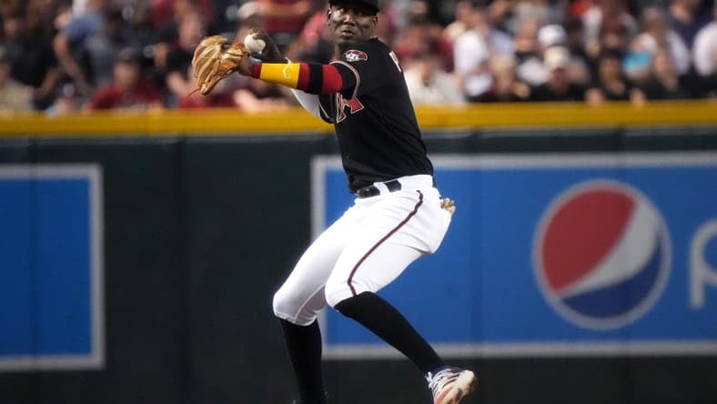 Jun 17, 2023; Phoenix, AZ, USA; Arizona Diamondbacks infielder Geraldo Perdomo (2) throws to first base after fielding a grounder against the Cleveland Guardians at Chase Field.