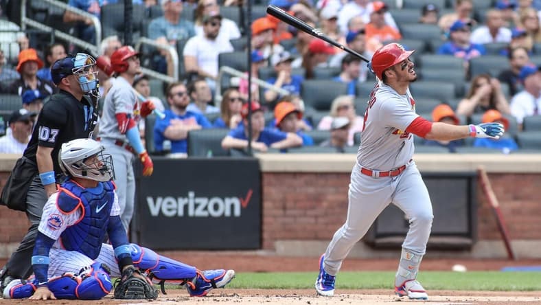 Jun 18, 2023; New York City, New York, USA; St. Louis Cardinals third baseman Nolan Arenado (28) hits a two run home run in the first inning against the New York Mets at Citi Field. Mandatory Credit: Wendell Cruz-USA TODAY Sports