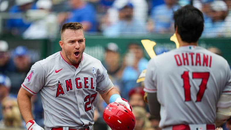 Jun 18, 2023; Kansas City, Missouri, USA; Los Angeles Angels center fielder Mike Trout (27) celebrates with designated hitter Shohei Ohtani (17) after hitting a home run during the fifth inning at Kauffman Stadium. Mandatory Credit: Jay Biggerstaff-USA TODAY Sports