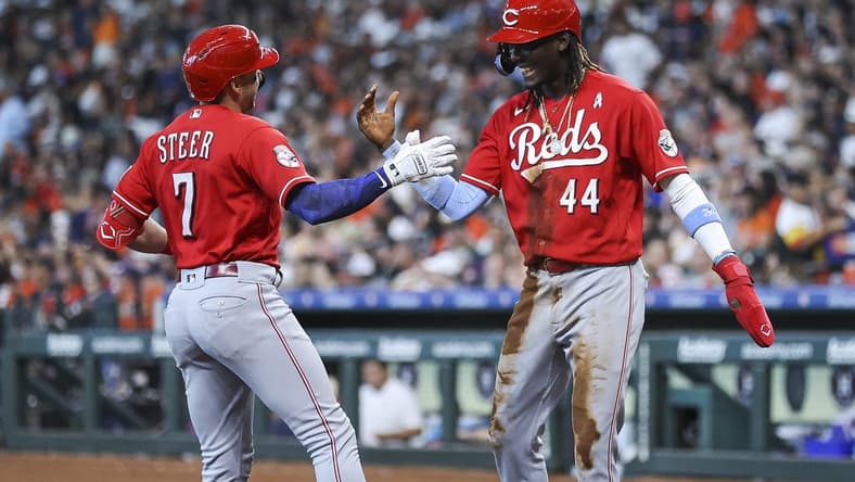 Jun 18, 2023; Houston, Texas, USA; Cincinnati Reds first baseman Spencer Steer (7) celebrates with shortstop Elly De La Cruz (44) after hitting a home run during the sixth inning against the Houston Astros at Minute Maid Park. Mandatory Credit: Troy Taormina-USA TODAY Sports