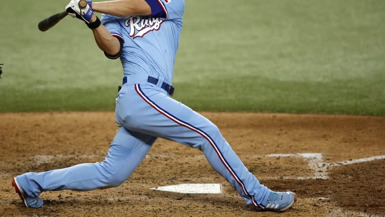Jun 18, 2023; Arlington, Texas, USA; Texas Rangers shortstop Corey Seager (5) hits a two RBI double in the fourth inning against the Toronto Blue Jays at Globe Life Field. Mandatory Credit: Tim Heitman-USA TODAY Sports