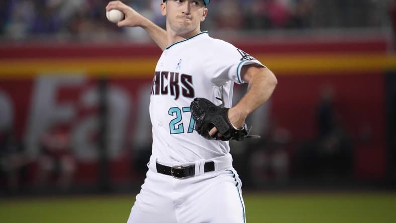 Jun 18, 2023; Phoenix, Arizona, USA; Arizona Diamondbacks starting pitcher Zach Davies (27) pitches against the Cleveland Guardians during the third inning at Chase Field. Mandatory Credit: Joe Camporeale-USA TODAY Sports