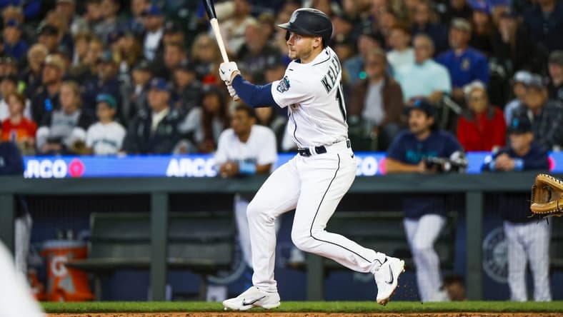 Jun 18, 2023; Seattle, Washington, USA; Seattle Mariners left fielder Jarred Kelenic (10) hits a three-run triple against the Chicago White Sox during the eighth inning at T-Mobile Park. Mandatory Credit: Joe Nicholson-USA TODAY Sports