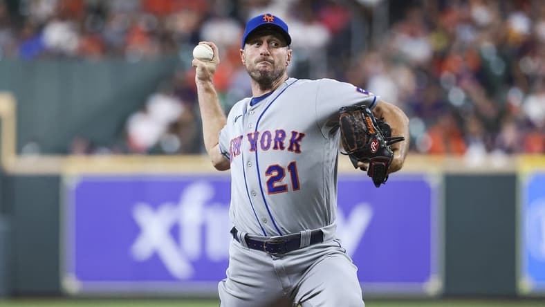 Jun 19, 2023; Houston, Texas, USA; New York Mets starting pitcher Max Scherzer (21) delivers a pitch during the second inning against the Houston Astros at Minute Maid Park. Mandatory Credit: Troy Taormina-USA TODAY Sports