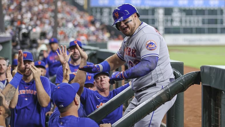 Jun 19, 2023; Houston, Texas, USA; New York Mets designated hitter Daniel Vogelbach (32) celebrates with teammates after hitting a home run during the third inning against the Houston Astros at Minute Maid Park. Mandatory Credit: Troy Taormina-USA TODAY Sports