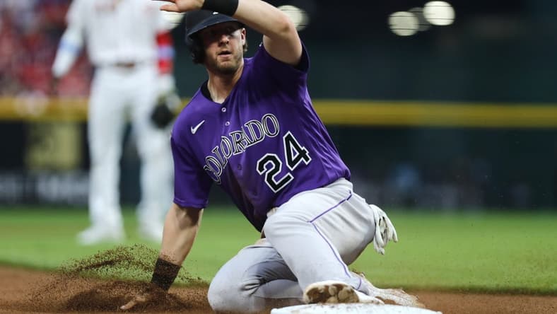 Jun 19, 2023; Cincinnati, Ohio, USA; Colorado Rockies third baseman Ryan McMahon (24) slides safely into third against the Cincinnati Reds during the sixth inning at Great American Ball Park. Mandatory Credit: David Kohl-USA TODAY Sports