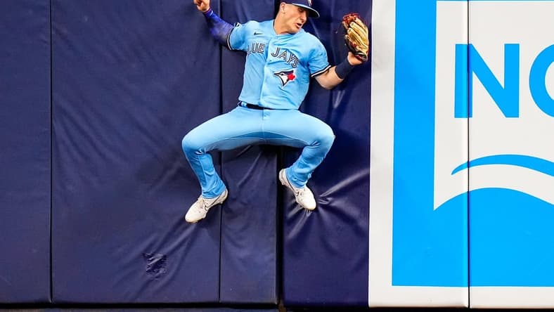 Jun 20, 2023; Miami, Florida, USA; Toronto Blue Jays left fielder Daulton Varsho (25) catches a fly ball against the Miami Marlins during the ninth inning at loanDepot Park. Mandatory Credit: Rich Storry-USA TODAY Sports