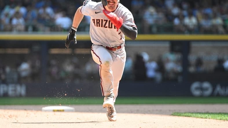 Jun 21, 2023; Milwaukee, Wisconsin, USA; Arizona Diamondbacks left fielder Corbin Carroll (7) runs to third base against the Milwaukee Brewers at American Family Field. Mandatory Credit: Michael McLoone-USA TODAY Sports