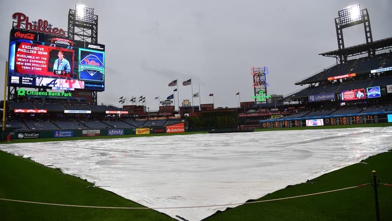 Jun 21, 2023; Philadelphia, Pennsylvania, USA; Tarp covers the infield during rain delay before start of game Philadelphia Phillies and Atlanta Braves at Citizens Bank Park. Mandatory Credit: Eric Hartline-USA TODAY Sports