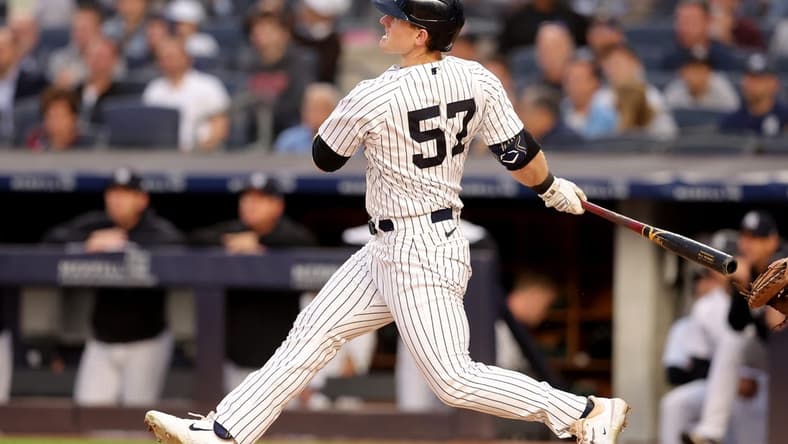 Jun 21, 2023; Bronx, New York, USA; New York Yankees left fielder Billy McKinney (57) follows through on a solo home run against the Seattle Mariners during the fourth inning at Yankee Stadium. Mandatory Credit: Brad Penner-USA TODAY Sports