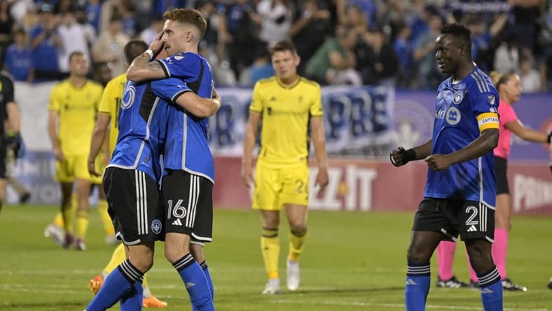 Jun 21, 2023; Montreal, Quebec, CAN;  CF Montreal defender Gabriele Corbo (25) and defender Joel Waterman (16) and midfielder Victor Wanyama (2) celebrate after the win against the Nashville SC at Stade Saputo. Mandatory Credit: Eric Bolte-USA TODAY Sports