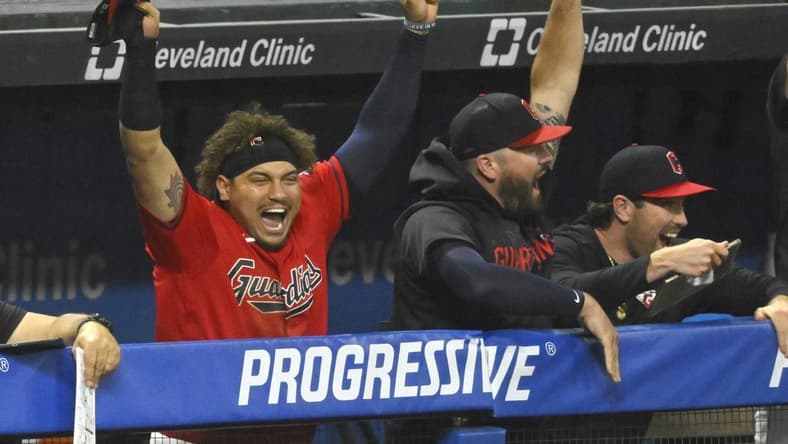 Jun 21, 2023; Cleveland, Ohio, USA; Cleveland Guardians first baseman Josh Naylor (left) celebrates after watching his brother, catcher Bo Naylor (not pictured), get his first hit in the eighth inning against the Oakland Athletics at Progressive Field. Mandatory Credit: David Richard-USA TODAY Sports