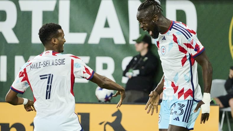 Jun 21, 2023; Portland, Oregon, USA; Chicago Fire forward Kei Kamara (23) celebrates with midfielder Maren Haile-Selassie (7) after scoring a goal in the second half against the Portland Timbers at Providence Park. Mandatory Credit: Troy Wayrynen-USA TODAY Sports