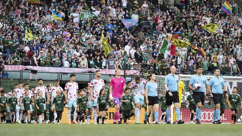 Jun 21, 2023; Portland, Oregon, USA;  The Portland Timbers and Chicago Fire make their way to the field before a game at Providence Park. Mandatory Credit: Troy Wayrynen-USA TODAY Sports