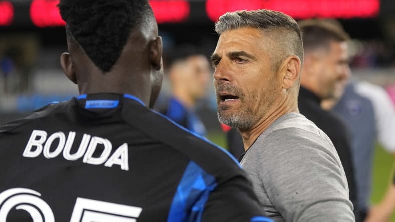 Jun 17, 2023; San Jose, California, USA; San Jose Earthquakes head coach Luchi Gonzalez (right) talks to forward Ousseni Bouda (25) after the game against the Portland Timbers at PayPal Park. Mandatory Credit: Darren Yamashita-USA TODAY Sports