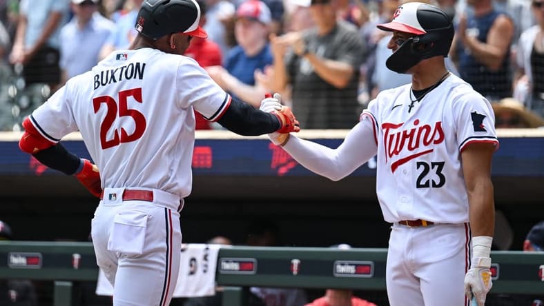Jun 22, 2023; Minneapolis, Minnesota, USA; Minnesota Twins designated hitter Byron Buxton (25) and third baseman Royce Lewis (23) react after Buxton hit his second home run of the day during the third inning at Target Field. Mandatory Credit: Jeffrey Becker-USA TODAY Sports