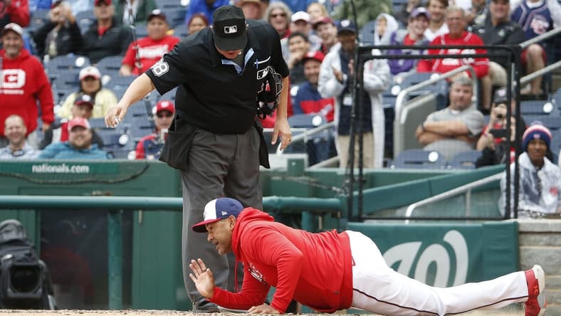 Jun 22, 2023; Washington, District of Columbia, USA; Washington Nationals manager Dave Martinez lays on home plate after being ejected during the fifth inning against the Arizona Diamondbacks at Nationals Park. Mandatory Credit: Amber Searls-USA TODAY Sports
