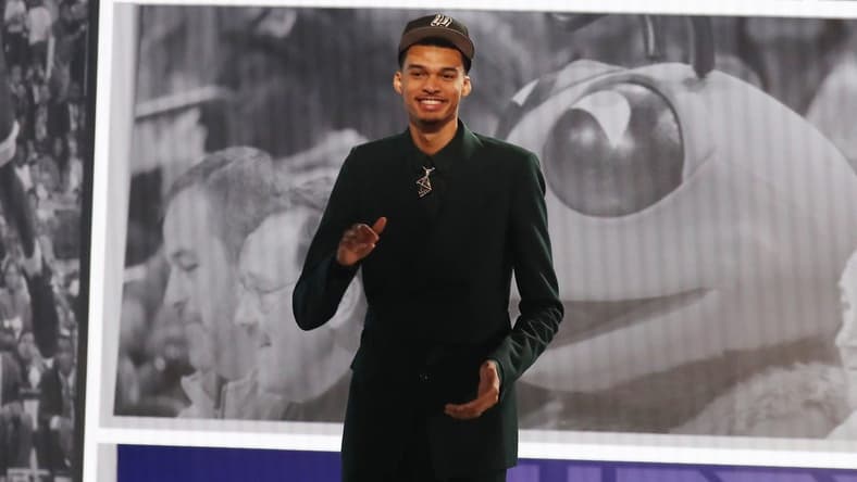 Jun 22, 2023; Brooklyn, NY, USA; Victor Wembanyama reacts after being selected first by the San Antonio Spurs in the first round of the 2023 NBA Draft at Barclays Arena. Mandatory Credit: Wendell Cruz-USA TODAY Sports