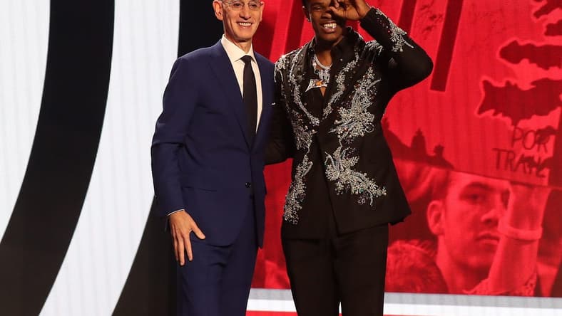Jun 22, 2023; Brooklyn, NY, USA; Scoot Henderson with NBA commissioner Adam Silver after being selected third by the Portland Trail Blazers in the first round of the 2023 NBA Draft at Barclays Arena. Mandatory Credit: Wendell Cruz-USA TODAY Sports