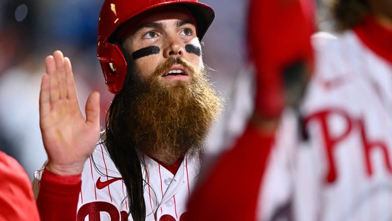 Jun 23, 2023; Philadelphia, Pennsylvania, USA; Philadelphia Phillies outfielder Brandon Marsh (16) celebrates in the dugout after scoring against the New York Mets in the sixth inning at Citizens Bank Park. Mandatory Credit: Kyle Ross-USA TODAY Sports