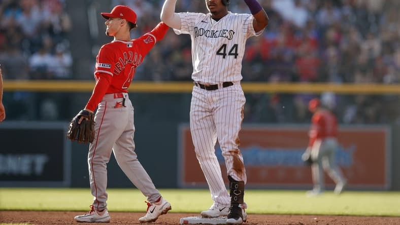 Jun 23, 2023; Denver, Colorado, USA; Colorado Rockies first baseman Elehuris Montero (44) reacts from second after hitting a double in the second inning against the Los Angeles Angels at Coors Field. Mandatory Credit: Isaiah J. Downing-USA TODAY Sports