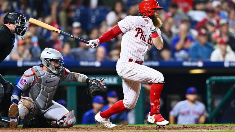 Jun 23, 2023; Philadelphia, Pennsylvania, USA; Philadelphia Phillies outfielder Brandon Marsh (16) hits an infield single against the New York Mets in the eighth inning at Citizens Bank Park. Mandatory Credit: Kyle Ross-USA TODAY Sports
