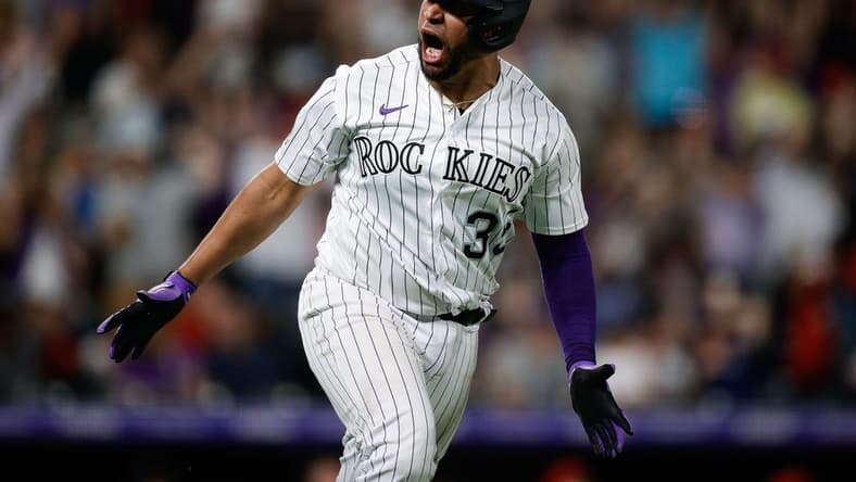 Jun 23, 2023; Denver, Colorado, USA; Colorado Rockies catcher Elias Diaz (35) reacts after hitting a grand slam in the eighth inning against the Los Angeles Angels at Coors Field. Mandatory Credit: Isaiah J. Downing-USA TODAY Sports
