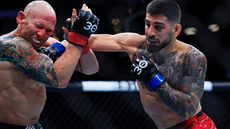Ilia Topuria lands a punch on Josh Emmett in a featherweight bout during the UFC Fight Night event Saturday, June 24, 2023 at VyStar Veterans Memorial Arena in Jacksonville, Fla. Ilia Topuria defeated Josh Emmett by unanimous decision in five rounds.