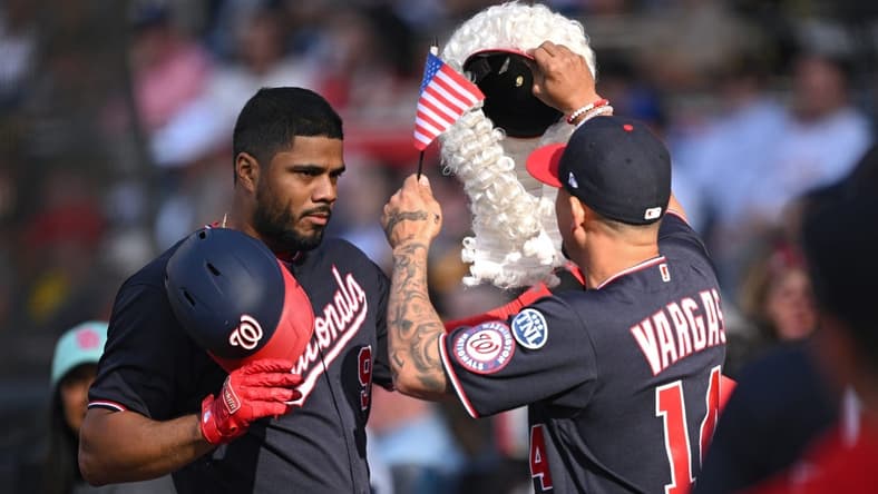 Jun 24, 2023; San Diego, California, USA; Washington Nationals third baseman Jeimer Candelario (9) is greeted at the dugout by shortstop Ildemaro Vargas (14) after hitting a home run against the San Diego Padres during the first inning at Petco Park. Mandatory Credit: Orlando Ramirez-USA TODAY Sports