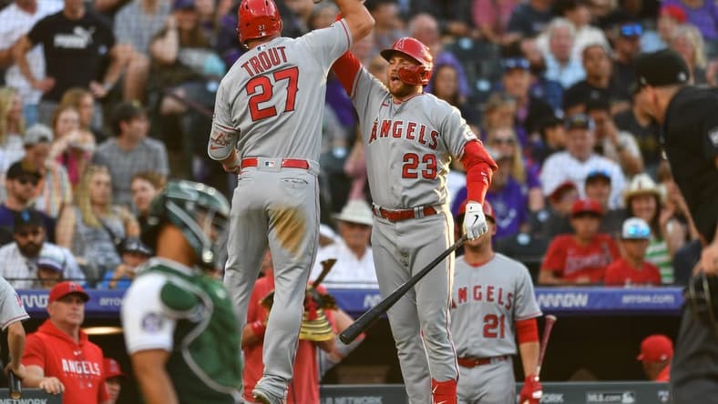 Jun 24, 2023; Denver, Colorado, USA; Los Angeles Angels center fielder Mike Trout (27) celebrates his home run with Los Angeles Angels second baseman Brandon Drury (23) in the third inning against the Colorado Rockies at Coors Field. Mandatory Credit: John Leyba-USA TODAY Sports