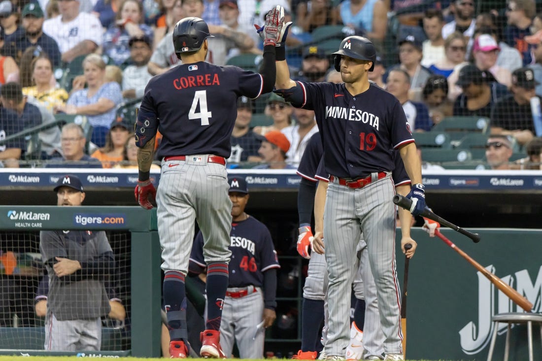Jun 24, 2023; Detroit, Michigan, USA; Minnesota Twins shortstop Carlos Correa (4) high fives first baseman Alex Kirilloff (19) after his solo home run against the Detroit Tigers at Comerica Park. Mandatory Credit: David Reginek-USA TODAY Sports