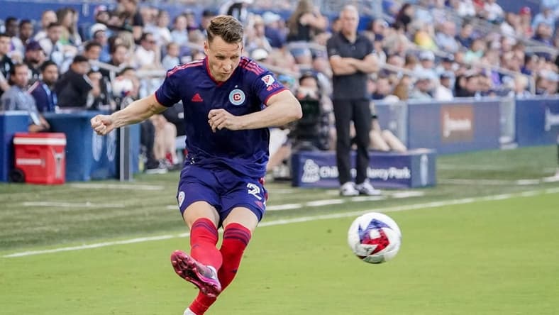 Jun 24, 2023; Kansas City, Kansas, USA; Chicago Fire midfielder Fabian Herbers (21) kicks a shot on goal against Sporting Kansas City during the first half at Children's Mercy Park. Mandatory Credit: Denny Medley-USA TODAY Sports