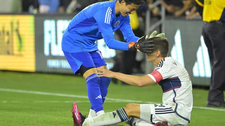 Jun 24, 2023; Los Angeles, California, USA; Vancouver Whitecaps goalkeeper Yohei Takaoka (18) celebrates with defender Ranko Veselinovic (4) after defeating the Los Angeles FC at BMO Stadium. Mandatory Credit: Jayne Kamin-Oncea-USA TODAY Sports