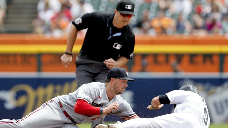 Jun 25, 2023; Detroit, Michigan, USA; Detroit Tigers third baseman Nick Maton (9) is tagged out by Minnesota Twins third baseman Kyle Farmer (12) trying to steal second in the fourth inning at Comerica Park. Mandatory Credit: Rick Osentoski-USA TODAY Sports