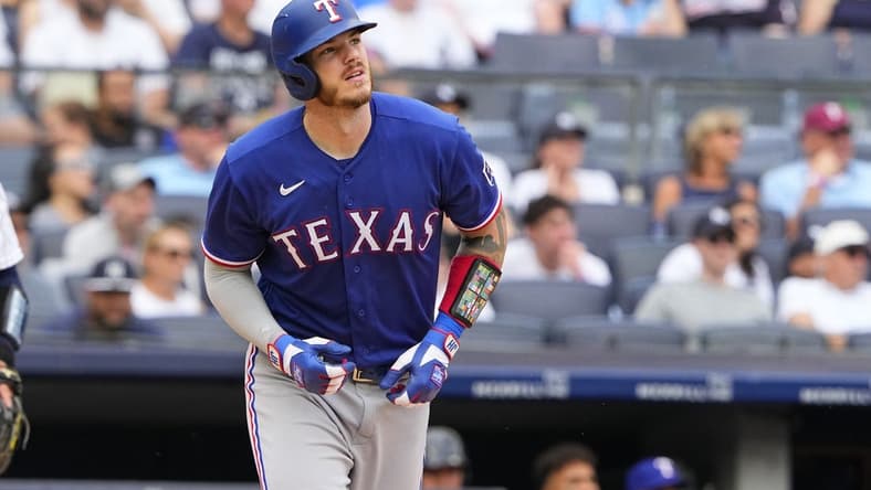 Jun 25, 2023; Bronx, New York, USA; Texas Rangers catcher Jonah Heim (28) watches his home run against the New York Yankees during the second inning at Yankee Stadium. Mandatory Credit: Gregory Fisher-USA TODAY Sports