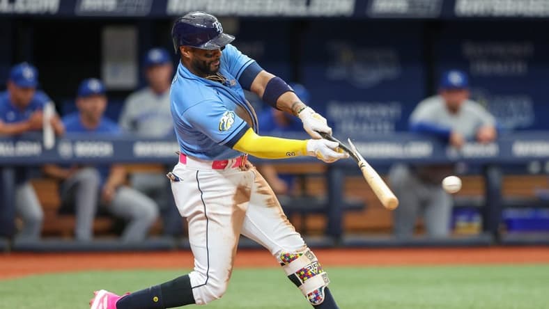Jun 25, 2023; St. Petersburg, Florida, USA;  Tampa Bay Rays first baseman Yandy Diaz (2) hits a single against the Kansas City Royals in the fifth inning at Tropicana Field. Mandatory Credit: Nathan Ray Seebeck-USA TODAY Sports